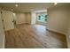 Large bedroom with hardwood floors and window at 6030 Preacher Hayes Rd, Mebane, NC 27302