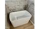 Freestanding soaking tub with marble tile surround at 6030 Preacher Hayes Rd, Mebane, NC 27302
