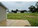 Private backyard with a concrete patio and open space at 83 Oakfield Trace Dr, Four Oaks, NC 27524