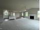 Open floorplan with kitchen island and living area at 83 Oakfield Trace Dr, Four Oaks, NC 27524