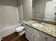 Bathroom with granite vanity and a shower/tub combo at 83 Oakfield Trace Dr, Four Oaks, NC 27524