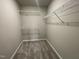 Walk-in closet with wire shelving at 83 Oakfield Trace Dr, Four Oaks, NC 27524