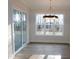 Breakfast nook with large windows and a modern chandelier at 51 Autumn Gate St, Pittsboro, NC 27312