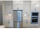 Stainless steel built-in appliances including refrigerator and microwave at 51 Autumn Gate St, Pittsboro, NC 27312