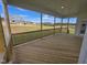 Covered deck with a view of the backyard and neighborhood at 5856 Genesee Dr., Homesite 16, Durham, NC 27712