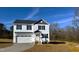 Two-story house with white siding, gray roof, and attached garage at 99 Mapledale Ct, Benson, NC 27504