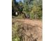 Mini excavator clearing land for construction at 878 Green Hill Rd, Franklinton, NC 27525