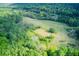 Aerial view of property showing large lot surrounded by lush forest at 878 Green Hill Rd, Franklinton, NC 27525