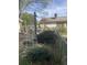 Side yard with overgrown vegetation and a chain link fence at 878 Green Hill Rd, Franklinton, NC 27525