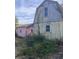 Two outbuildings, one pink and one yellow, in need of some TLC at 878 Green Hill Rd, Franklinton, NC 27525
