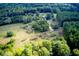 Aerial view of land with a mix of cleared and wooded areas at 878 Green Hill Rd, Franklinton, NC 27525