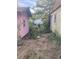 Backyard between two outbuildings, showing a cleared space at 878 Green Hill Rd, Franklinton, NC 27525