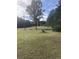 Spacious backyard with large trees and open space at 878 Green Hill Rd, Franklinton, NC 27525