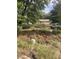 Cleared lot with some debris and overgrown weeds at 878 Green Hill Rd, Franklinton, NC 27525