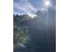 Backyard with a deck, fence, and overgrown areas at 878 Green Hill Rd, Franklinton, NC 27525