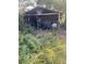 Cluttered workshop with tools and equipment under a carport at 878 Green Hill Rd, Franklinton, NC 27525