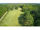 Aerial view of property showcasing expansive land and lush greenery at 878 Green Hill Rd, Franklinton, NC 27525