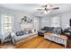Relaxing living room with hardwood floors and a cozy sectional sofa at 8401 Mitchell Mill Rd, Zebulon, NC 27597