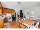 Bright dining area adjacent to the kitchen with a light green table and chairs at 8401 Mitchell Mill Rd, Zebulon, NC 27597