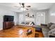 Cozy living room with hardwood floors and a sectional sofa at 8401 Mitchell Mill Rd, Zebulon, NC 27597