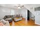 Comfortable living room with hardwood floors and L-shaped sofa at 8401 Mitchell Mill Rd, Zebulon, NC 27597