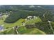 Aerial view of property showing home, barns and surrounding land at 8401 Mitchell Mill Rd, Zebulon, NC 27597