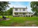 Charming two-story farmhouse with a large front yard at 8401 Mitchell Mill Rd, Zebulon, NC 27597