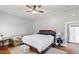 Bright bedroom with hardwood floors, a comfy bed, and plenty of natural light at 8401 Mitchell Mill Rd, Zebulon, NC 27597