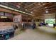 Barn interior with multiple horse stalls and storage containers at 8401 Mitchell Mill Rd, Zebulon, NC 27597