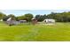 Aerial view of property showing multiple barns, horse, and expansive pasture at 8401 Mitchell Mill Rd, Zebulon, NC 27597