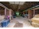 Barn with multiple stalls, hay bales, and ample space for horses at 8401 Mitchell Mill Rd, Zebulon, NC 27597