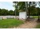 Rustic white shed near an equestrian jumping arena at 8401 Mitchell Mill Rd, Zebulon, NC 27597