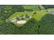Aerial view of property with home, barn, and riding arena at 8401 Mitchell Mill Rd, Zebulon, NC 27597