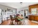 Cozy dining area with a light green table and chairs near the kitchen and back door at 8401 Mitchell Mill Rd, Zebulon, NC 27597