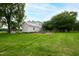Farmhouse with chicken coop and well house in backyard at 8401 Mitchell Mill Rd, Zebulon, NC 27597