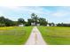 Aerial view of farmhouse and long driveway at 8401 Mitchell Mill Rd, Zebulon, NC 27597