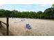 Spacious riding arena with sand footing and jump obstacles at 8401 Mitchell Mill Rd, Zebulon, NC 27597