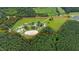 Aerial view of property showing home, various buildings, and riding arena at 8401 Mitchell Mill Rd, Zebulon, NC 27597