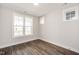 Bright bedroom with hardwood floors and large windows at 2332 Whitewing Ln # 2451, Wendell, NC 27591