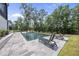 Relaxing pool area with lounge chairs and a view of nature at 7417 Dover Hills Dr, Wake Forest, NC 27587