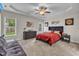 Main bedroom with king bed and ceiling fan at 97 Shady Oaks Dr, Benson, NC 27504