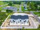 Aerial view showcasing rear of four-unit townhouses and surrounding area at 98 Linda St, Princeton, NC 27569