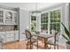 Bright breakfast nook with a wooden table and large windows at 321 Bailey Ridge Dr, Morrisville, NC 27560