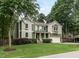 Two-story house with green siding, white trim, and a two-car garage at 121 Inwood Forest Dr, Raleigh, NC 27603