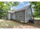 Gray sided home with back patio and wooded view at 140 Applegate Dr, Franklinton, NC 27525