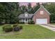 Brick house with a two-car garage and well-maintained lawn at 140 Applegate Dr, Franklinton, NC 27525
