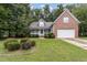 Brick and gray siding two-story house with attached garage at 140 Applegate Dr, Franklinton, NC 27525