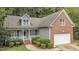 Two-story house with gray siding, brick accents, and attached garage at 140 Applegate Dr, Franklinton, NC 27525