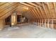 Large unfinished attic space with high ceilings and potential for future expansion at 140 Applegate Dr, Franklinton, NC 27525