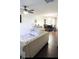 Open living and dining area with hardwood floors, neutral decor, and comfy sofas at 509 Hallie Long Ln, Burlington, NC 27217